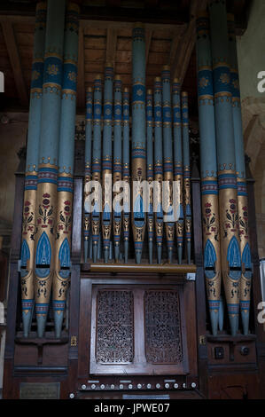 Organ pipes in St. Andrew`s Church, Arthingworth, Northamptonshire, England, UK Stock Photo